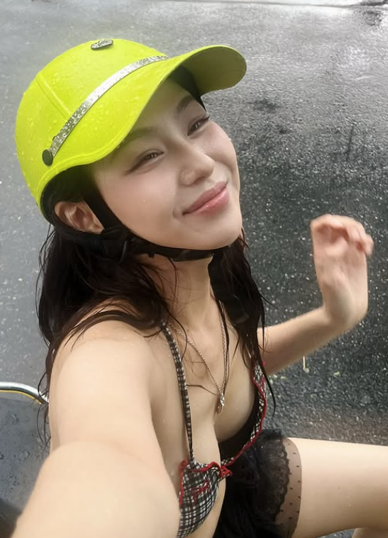 The buzz around images of a pretty girl in a bikini, innocently checking in on the street: Attractive outfit but inappropriate 2 Beautiful girl in bikini enjoying her time during the rain.